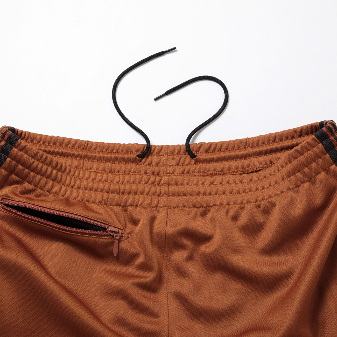 Needles / ニードルズ | Zipped Track Pant - Poly Smooth - Rust